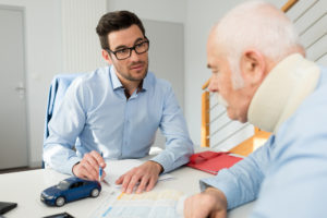 Injured driver talking to a Spring Hill personal injury lawyer.