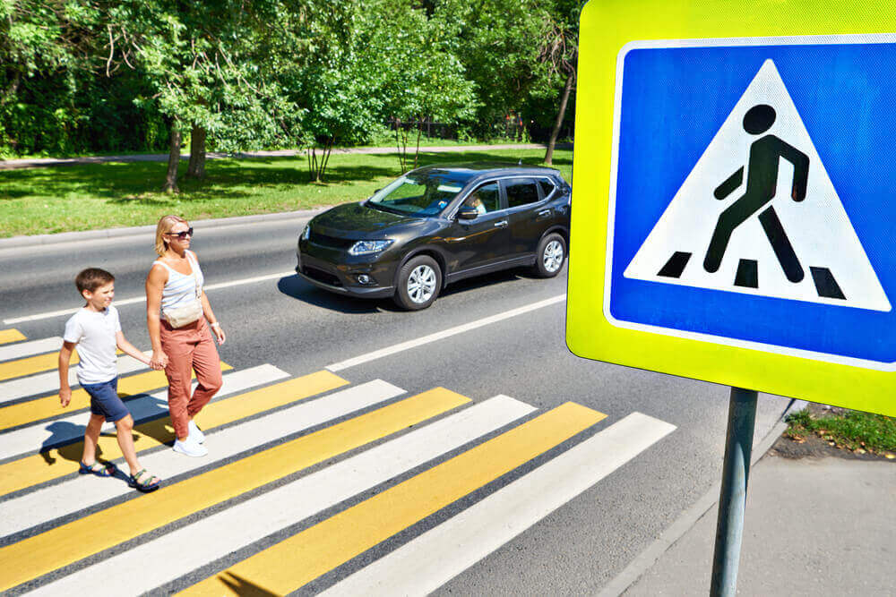 Pedestrians crossing the street safely.