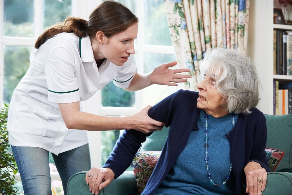 Senior woman got scared by her caregiver in nursing home.