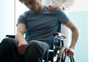 Depressed injured man on wheelchair