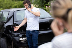 Driver involving accident calling his lawyer.