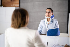 Lady injured with neck collar from accident filing claims.